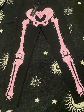 Dolls kills Studded pink Skeleton denim jeans